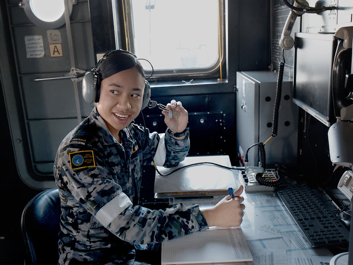 A member of the Navy radios from the ship.